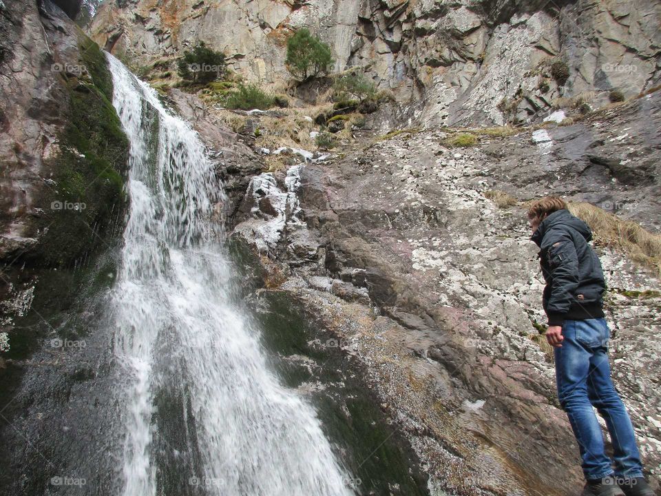 Man and waterfall