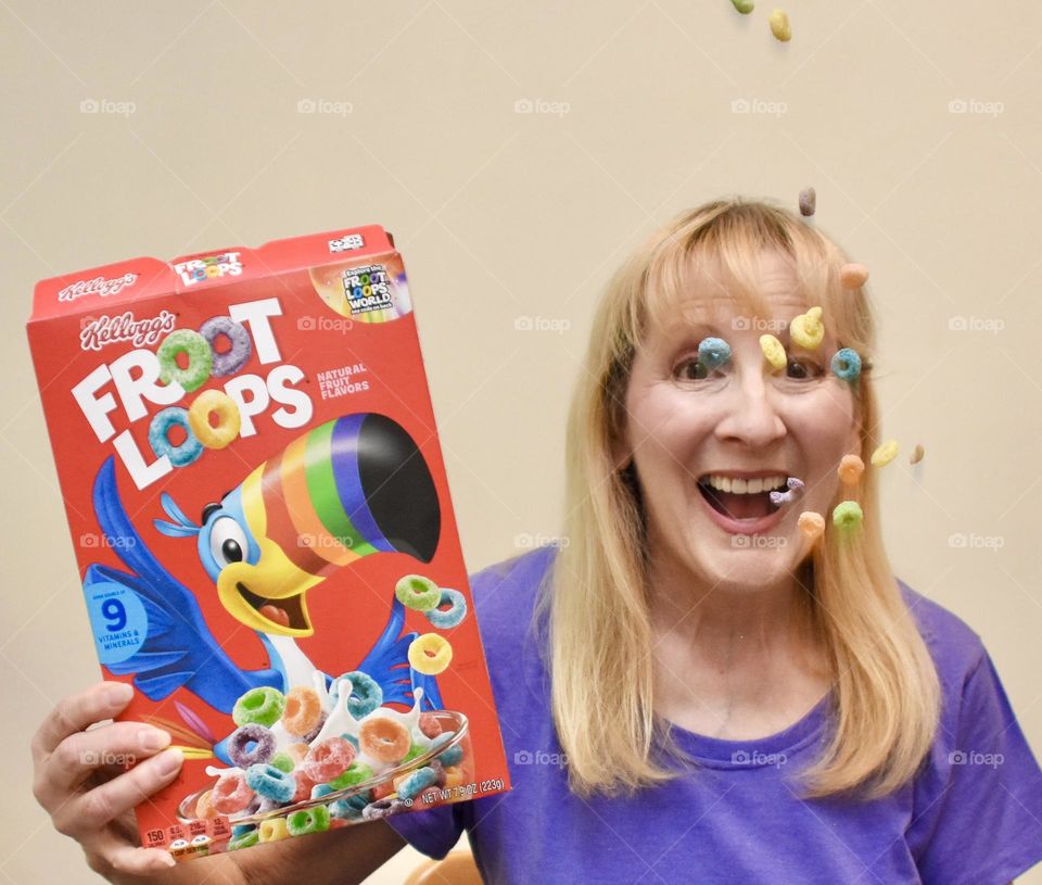 Woman with Froot Loops floating in the air 