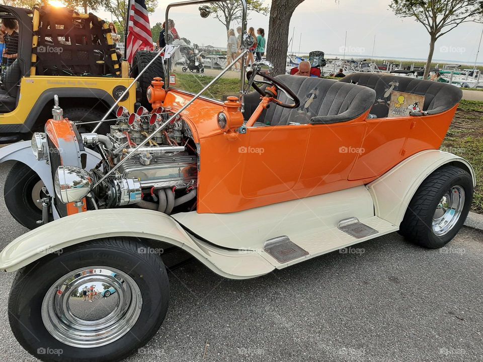 Antique car with engine out.