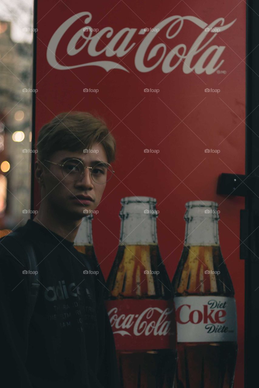 Male Hipster Wearing Adidas Sweater, Posing in front of Red Coca-Cola Machine
