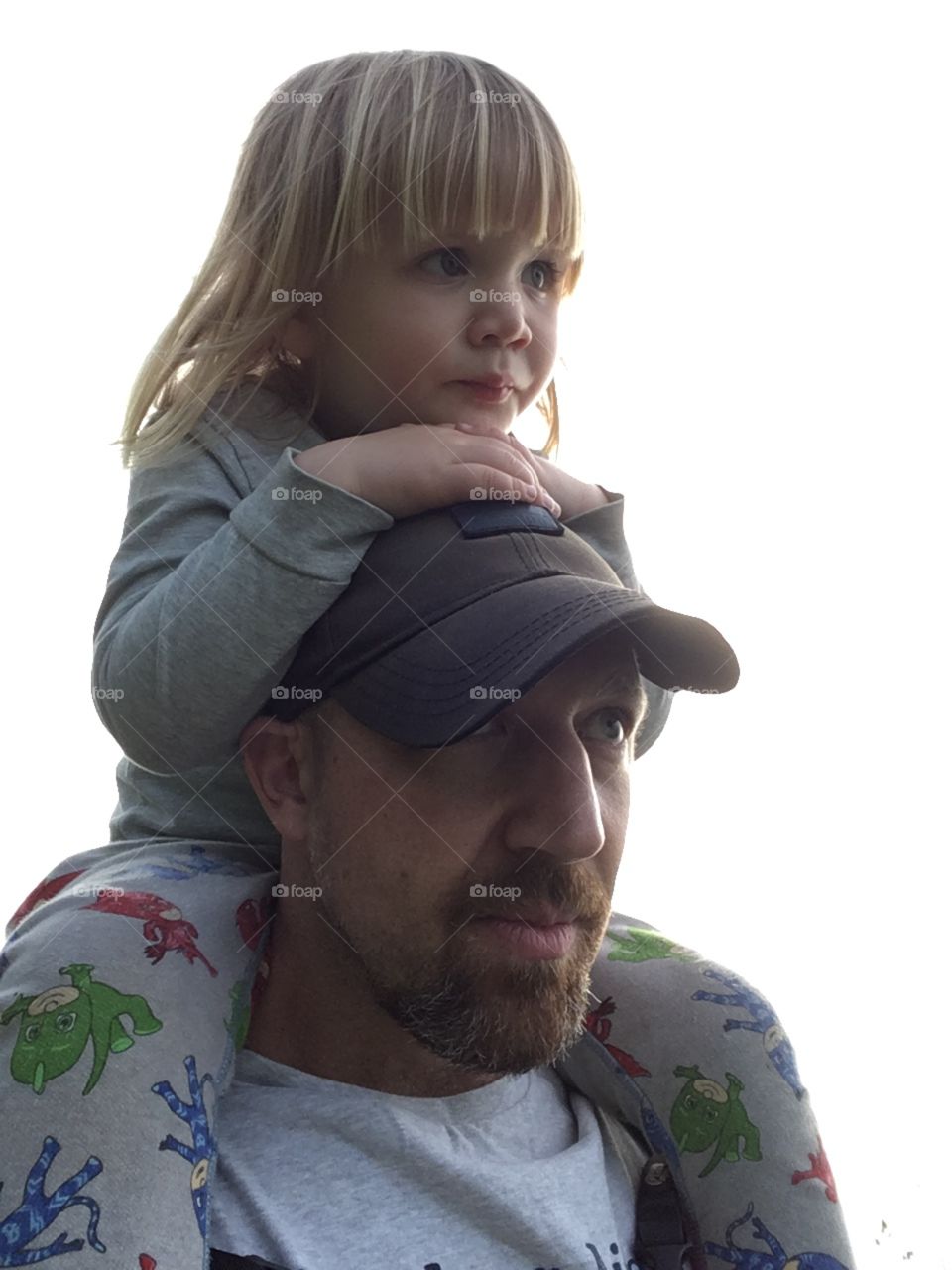 Young child sitting on the shoulders of his father whilst walking the coastal path of North Devon. 