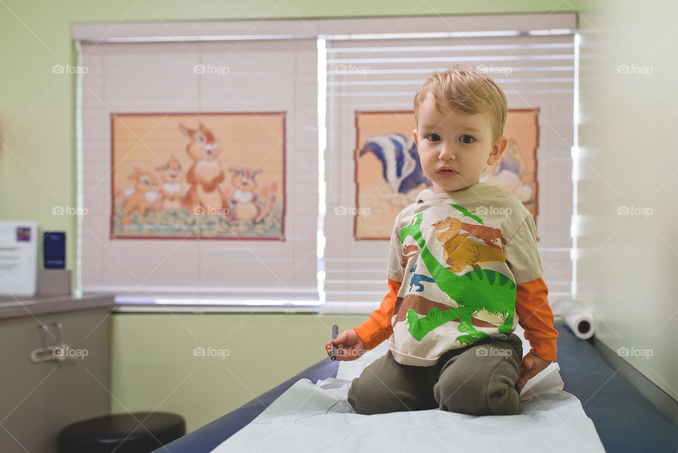 Boy drawing at doctors office