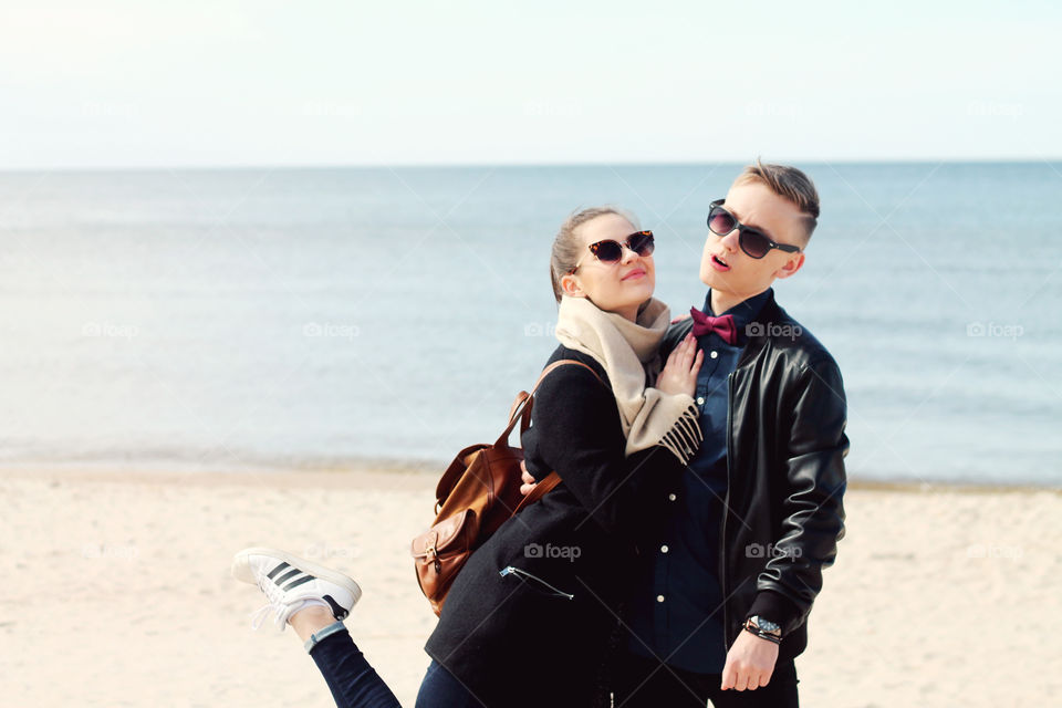 Cute couple posing at beach