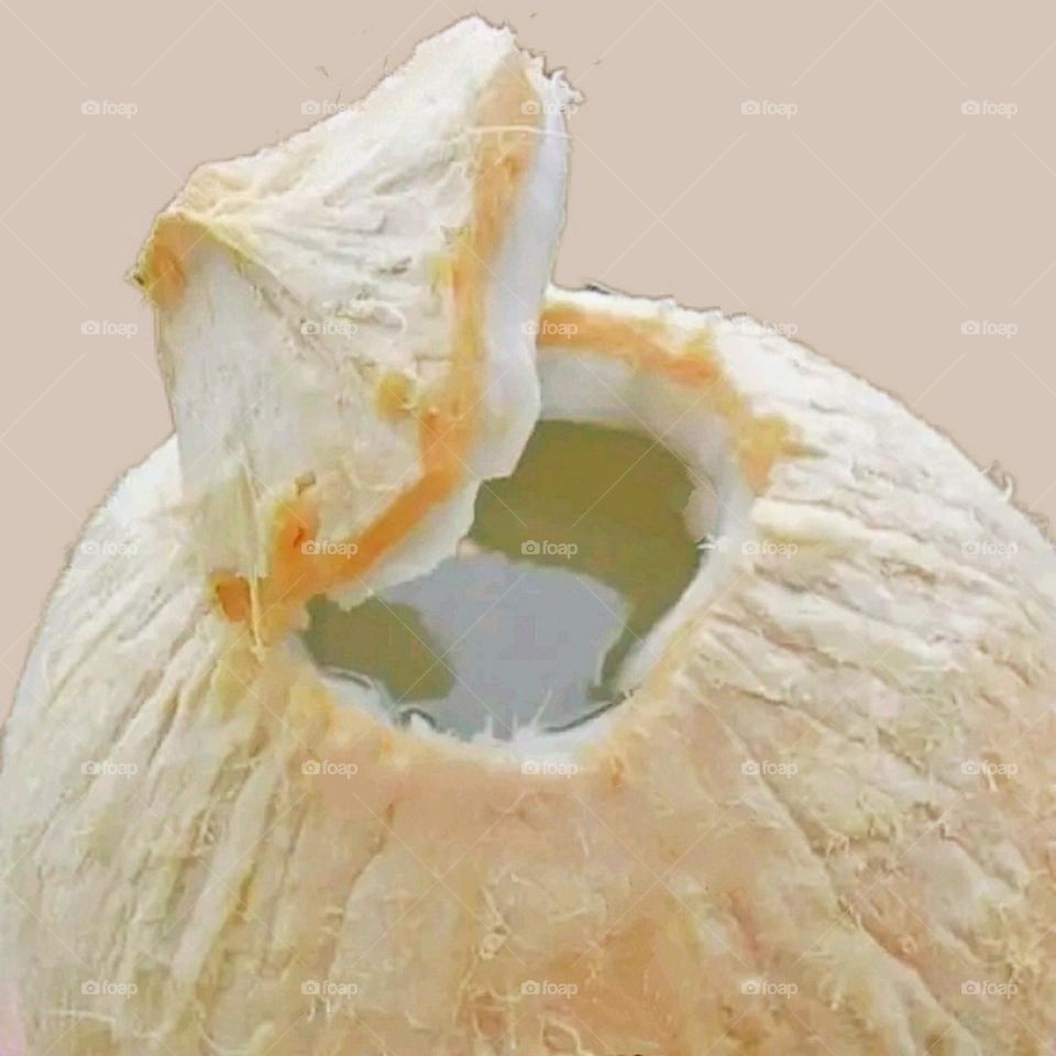 Coconut water is being enjoyed in the morning.