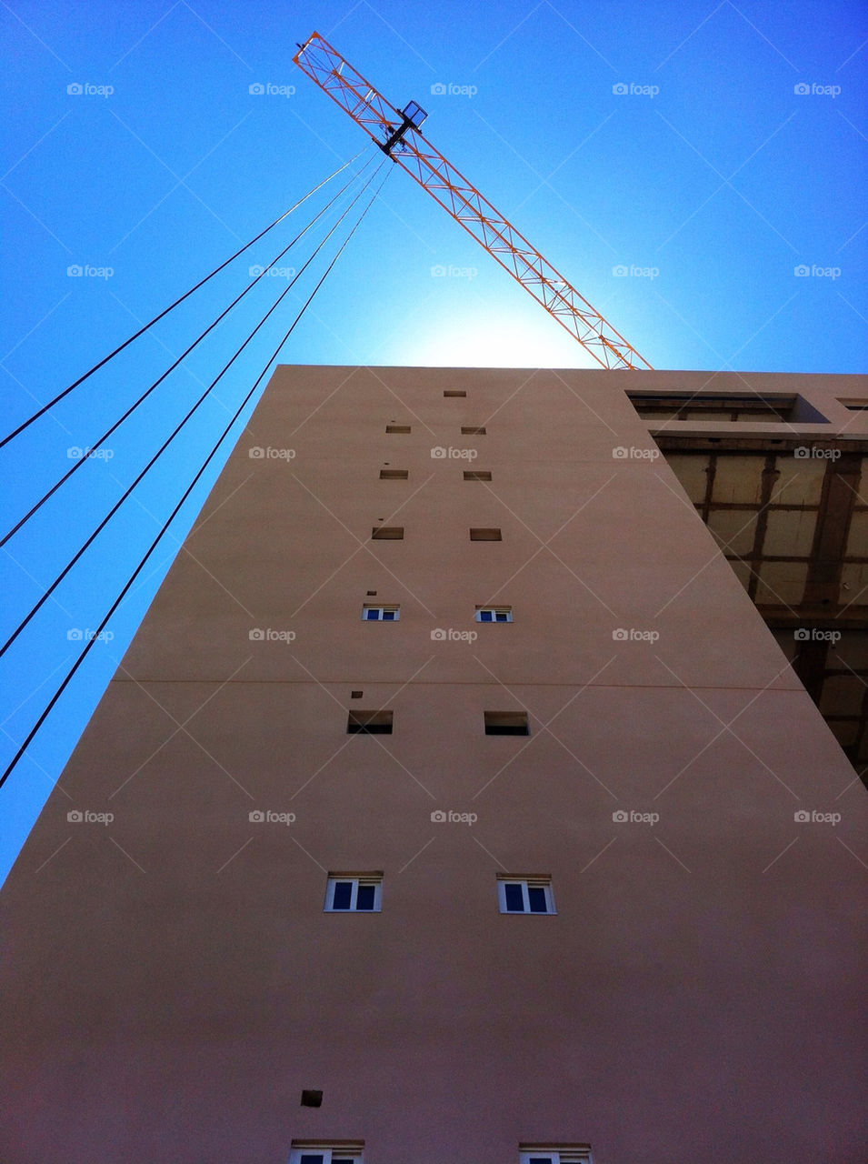 sky blue construction building by geraltamirano