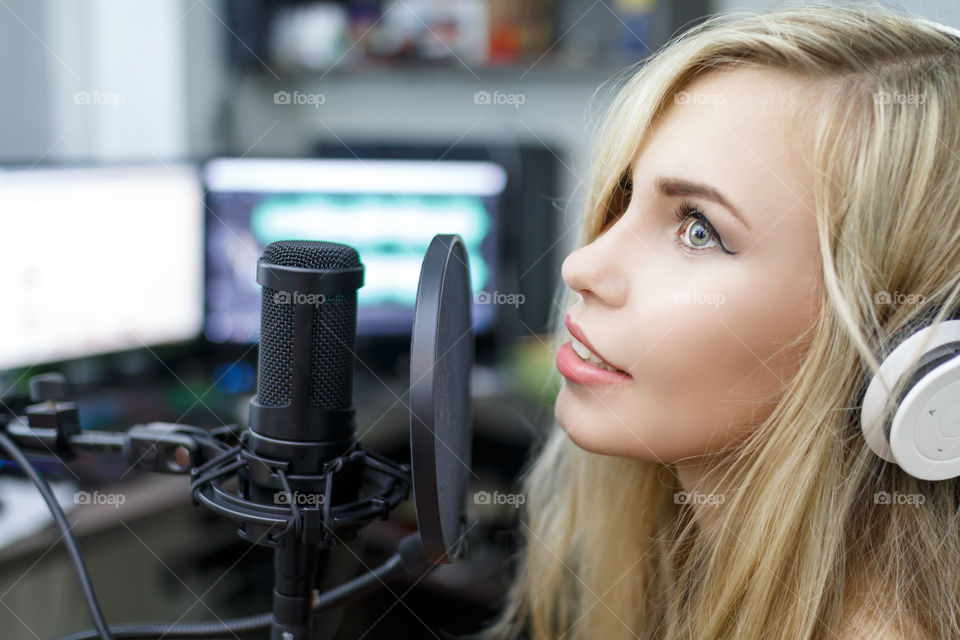 girl singing into a microphone