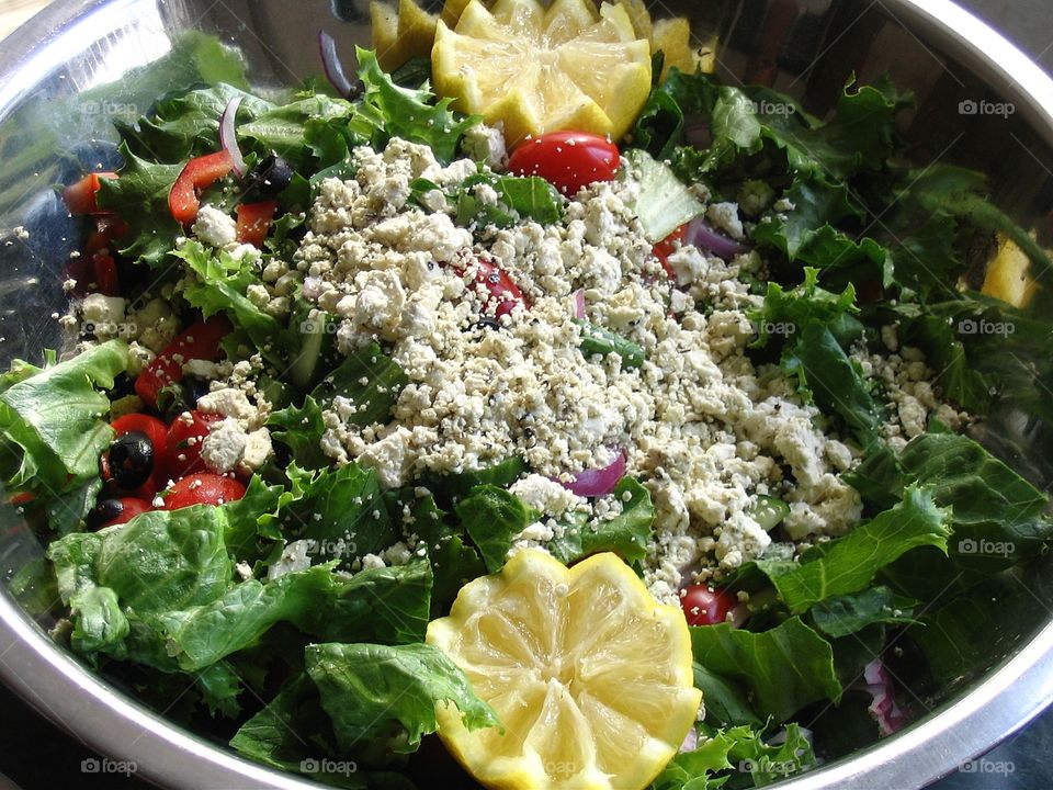 Delicious salad. Delicious salad, assorted lettuce, cherry tomatoes, feta cheese