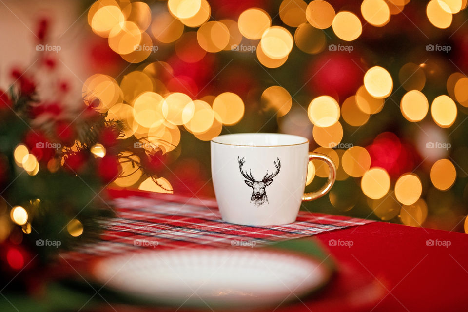 cup of coffee in a cozy festive Christmas atmosphere