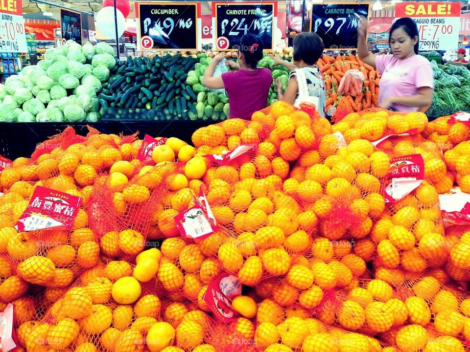 Mini oranges and other fruits and vegetables sold at a supemarket