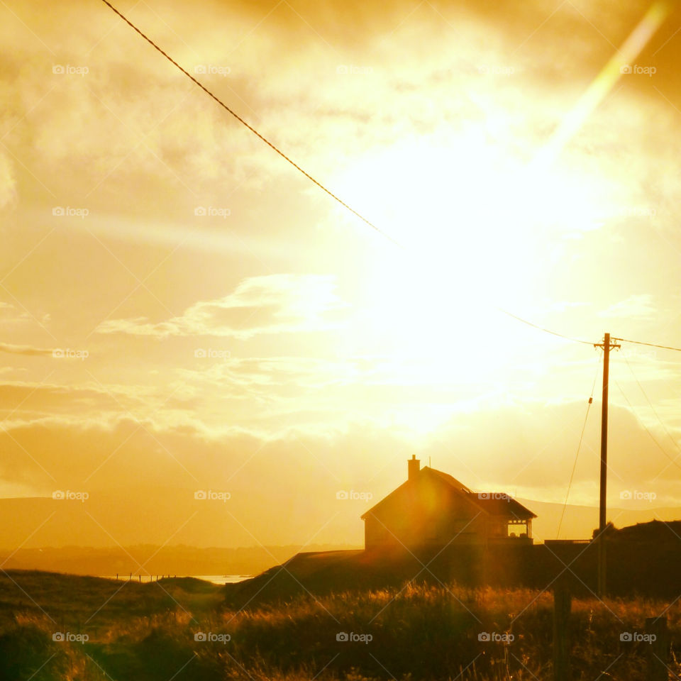 Sunset over the house on the hill..