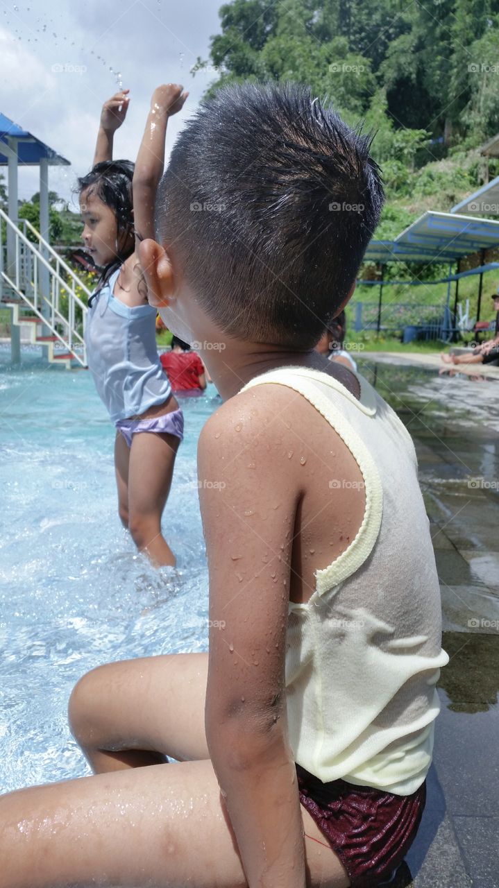 boy playing water