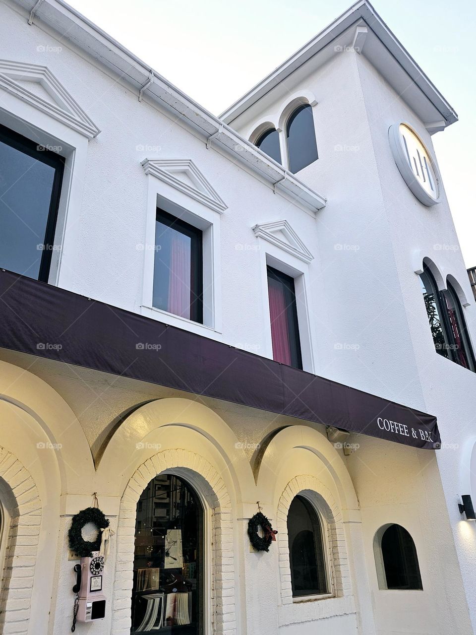 Pure white European style building and retro telephone