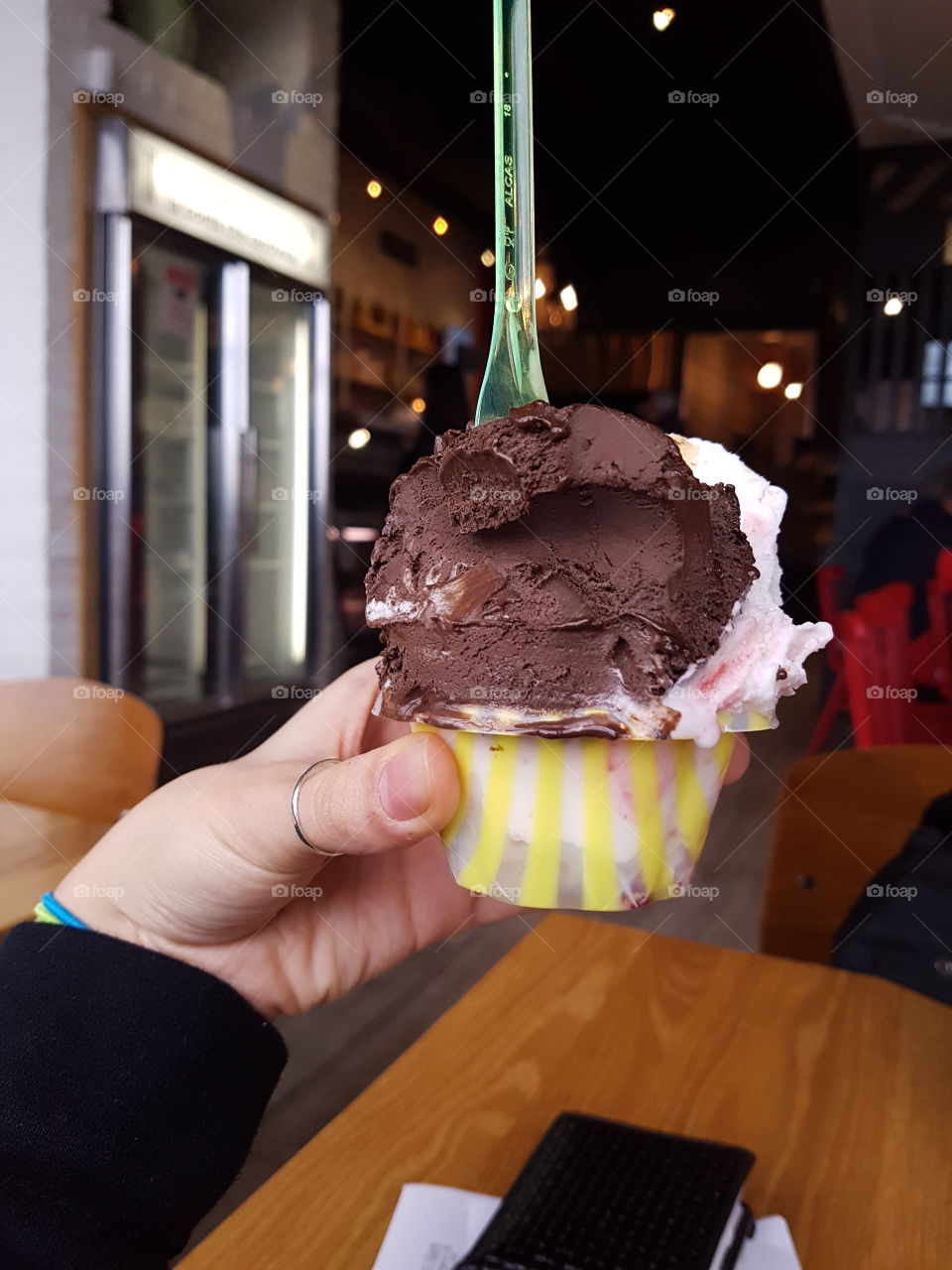Hand holding a cup of gelato