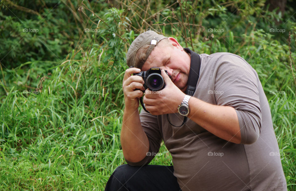 Male photographer taking pictures