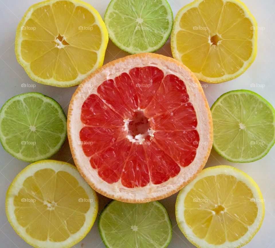 Fruits! - Grapefruit, lime and lemon halves on white background