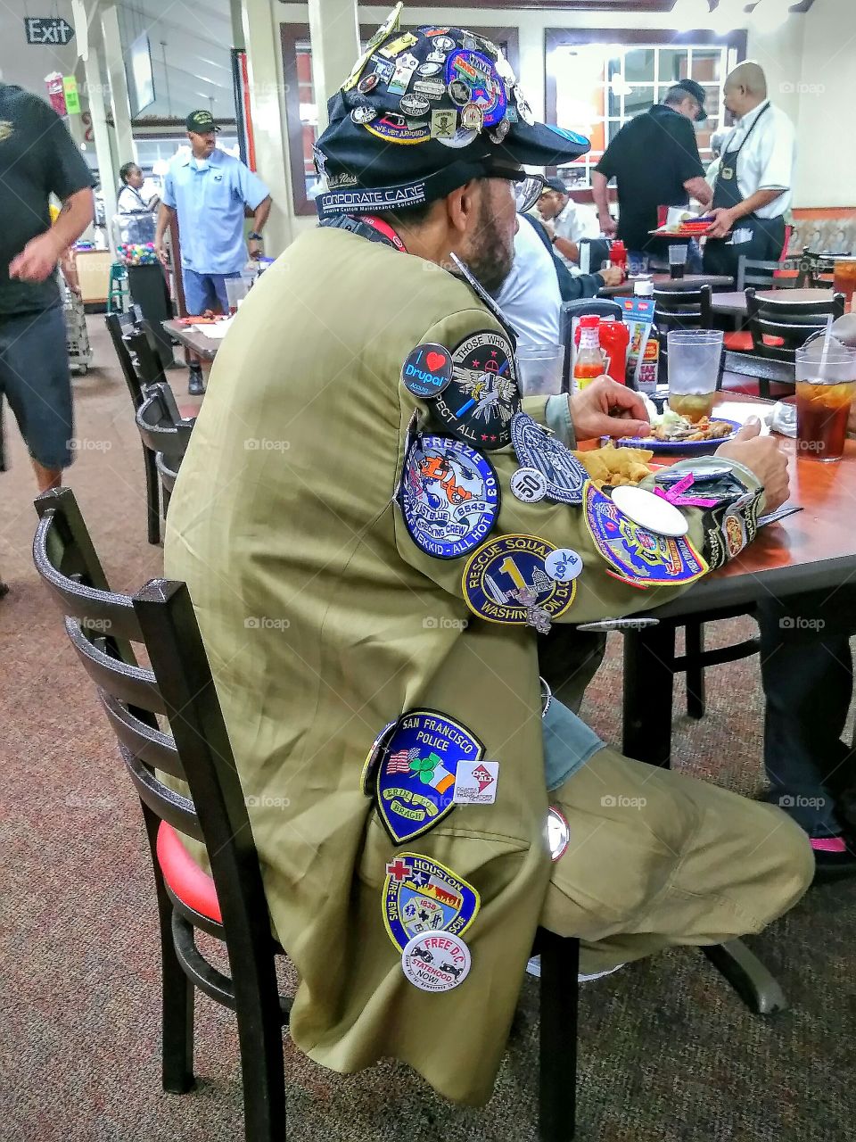 Veteran celebrating Veterans  Day dinner at restaurant.