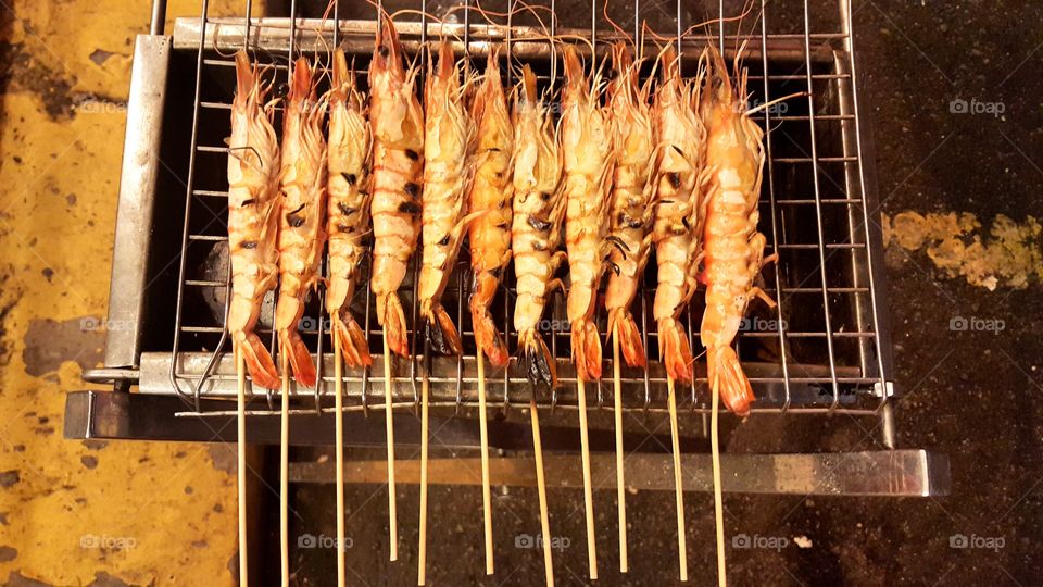 High angle view of barbecue prawn