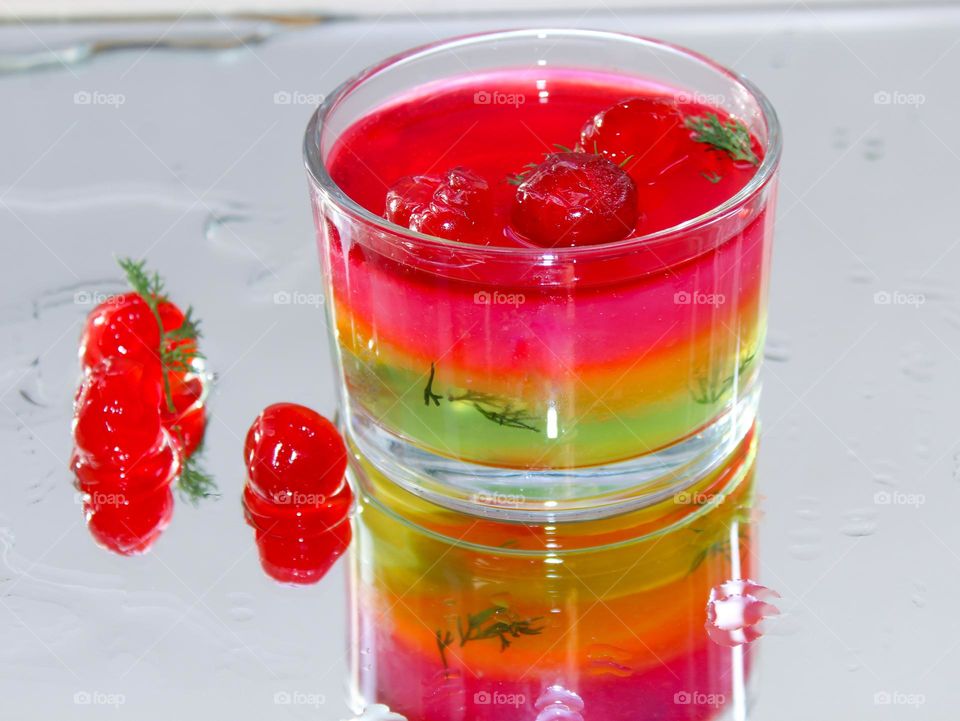 Fruit jelly with cherries in a glass