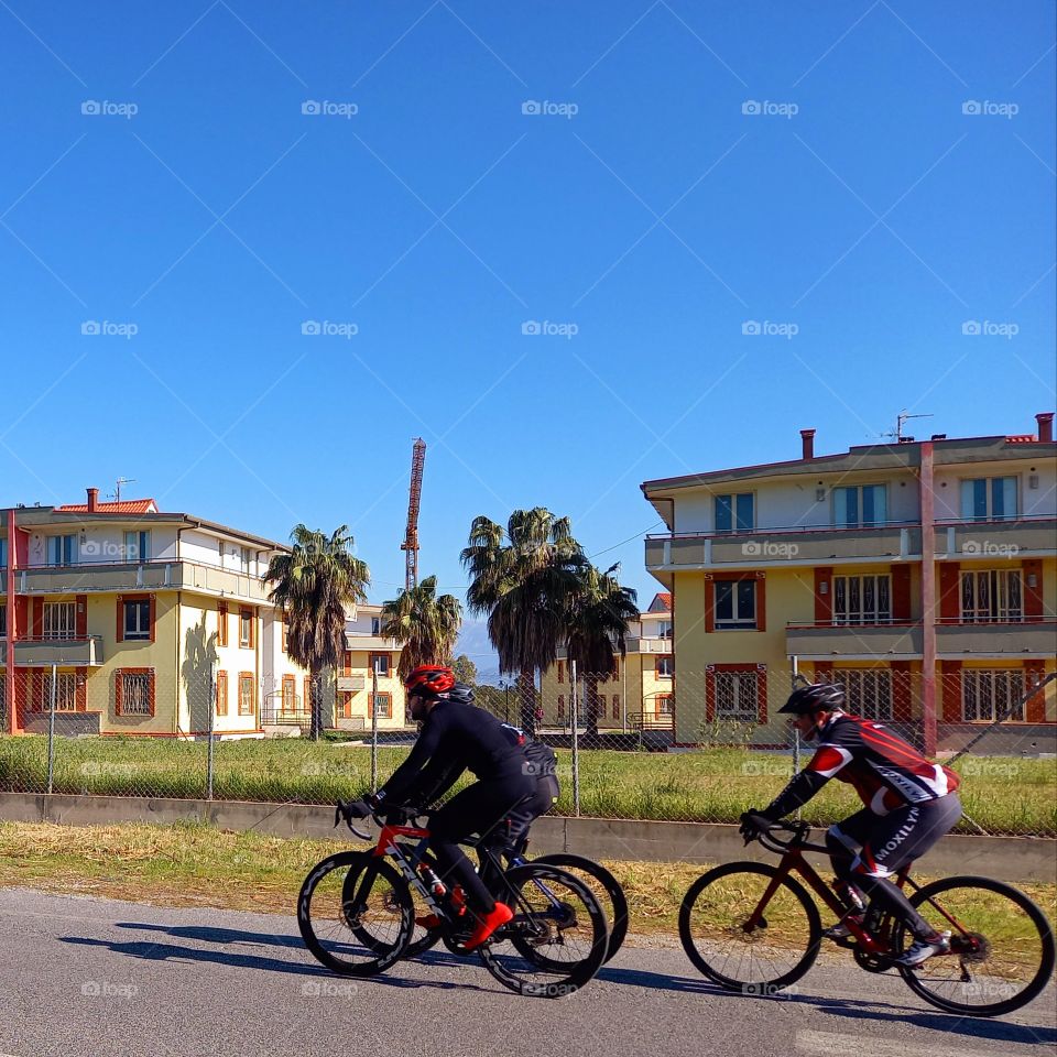 3 people are cycling