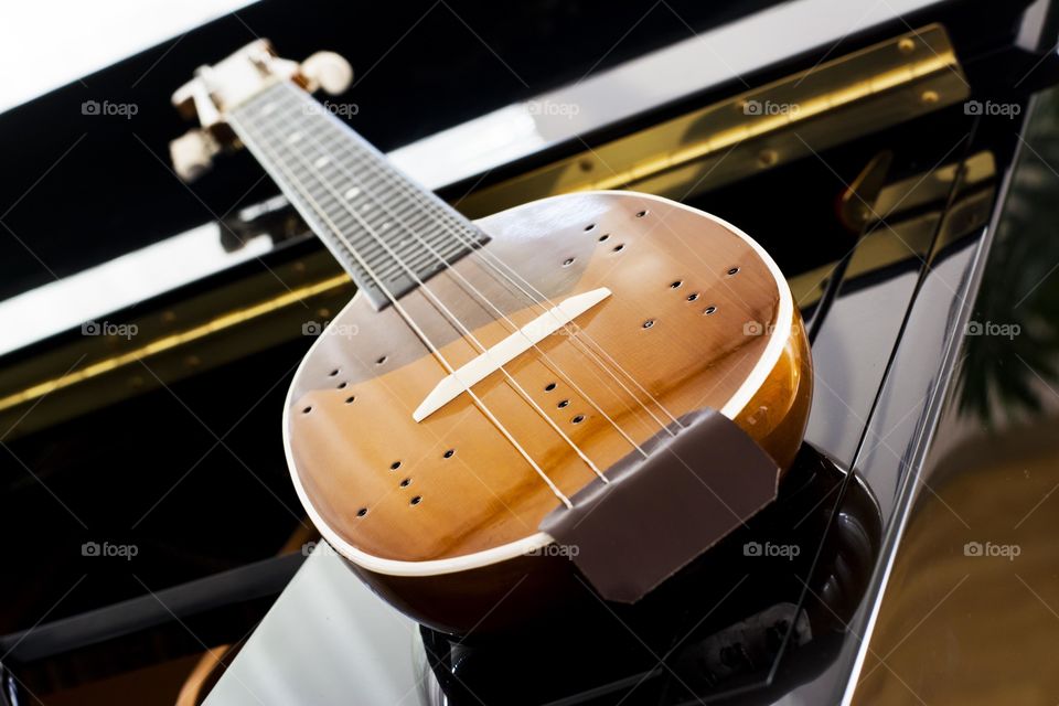 tamburitza instrument. tambiritza balkan instrument on piano