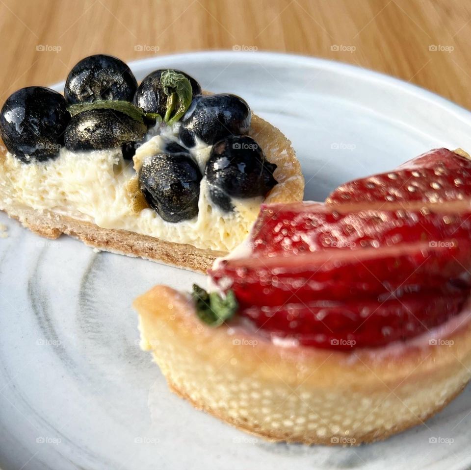 Homemade yummy colourful fruit tarts in berries 