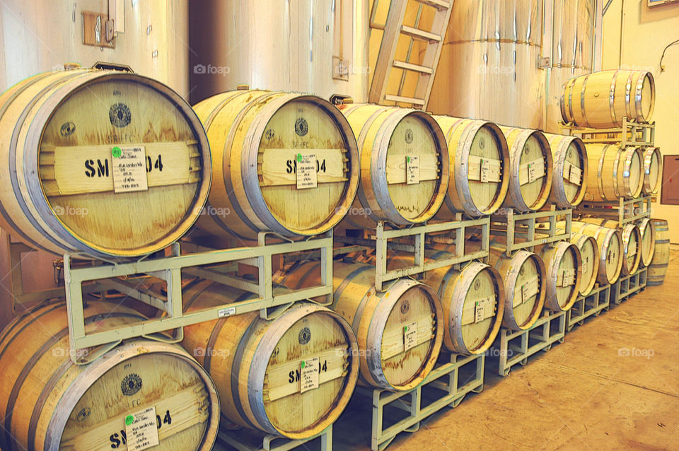 Wine cask lined up for storage at a winery in Napa California.