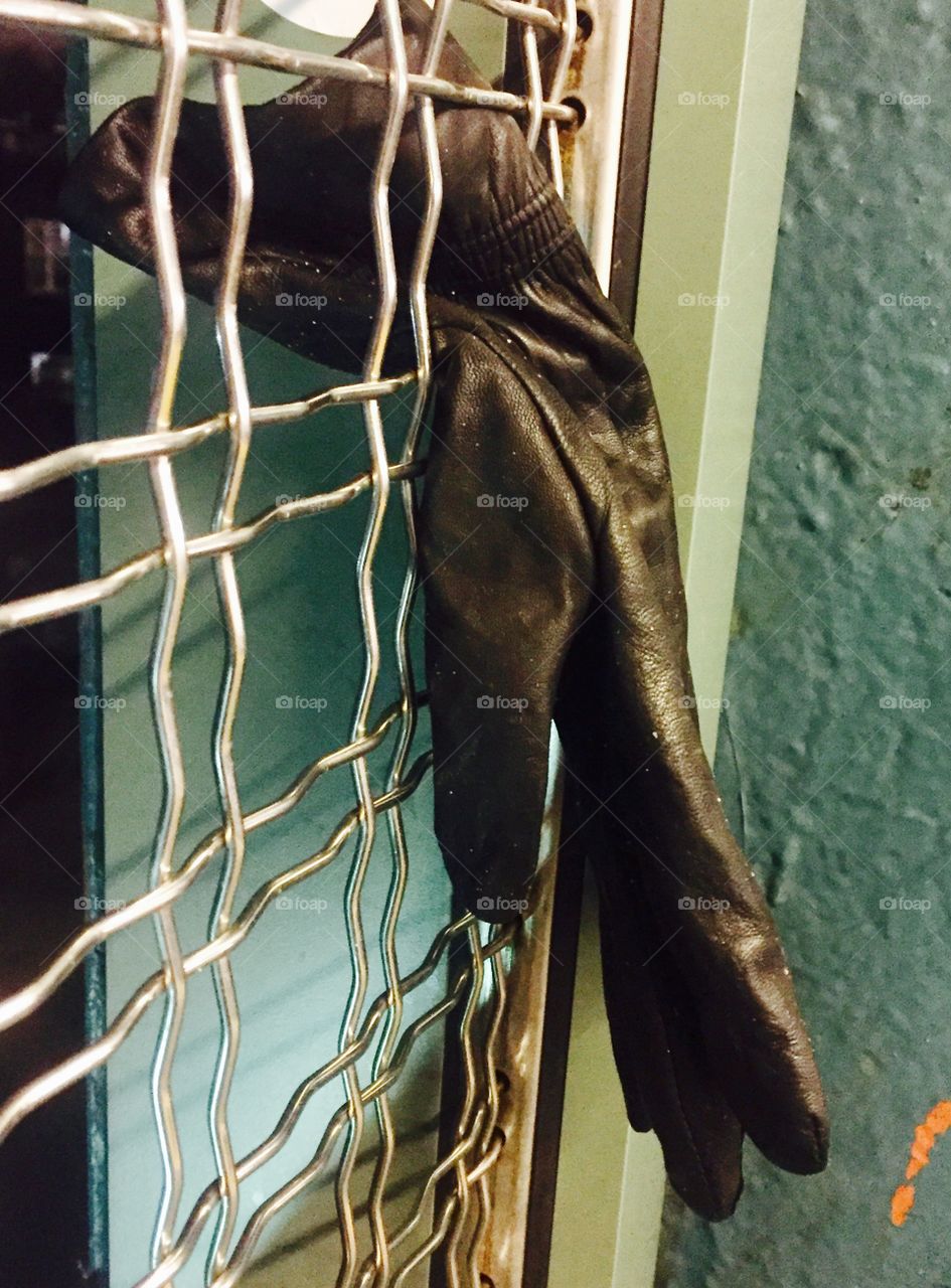 Glove on the subway fence