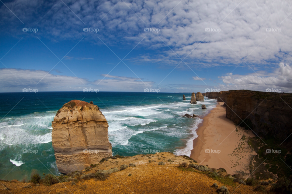 beach ocean blue clouds by liquideyes