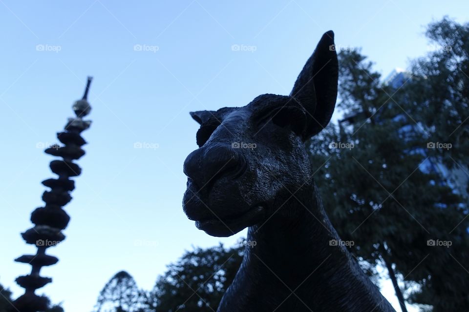 A kangaroo statue with “The Ore Obelisk” in Stirling Gardens, Perth, Western Australia.