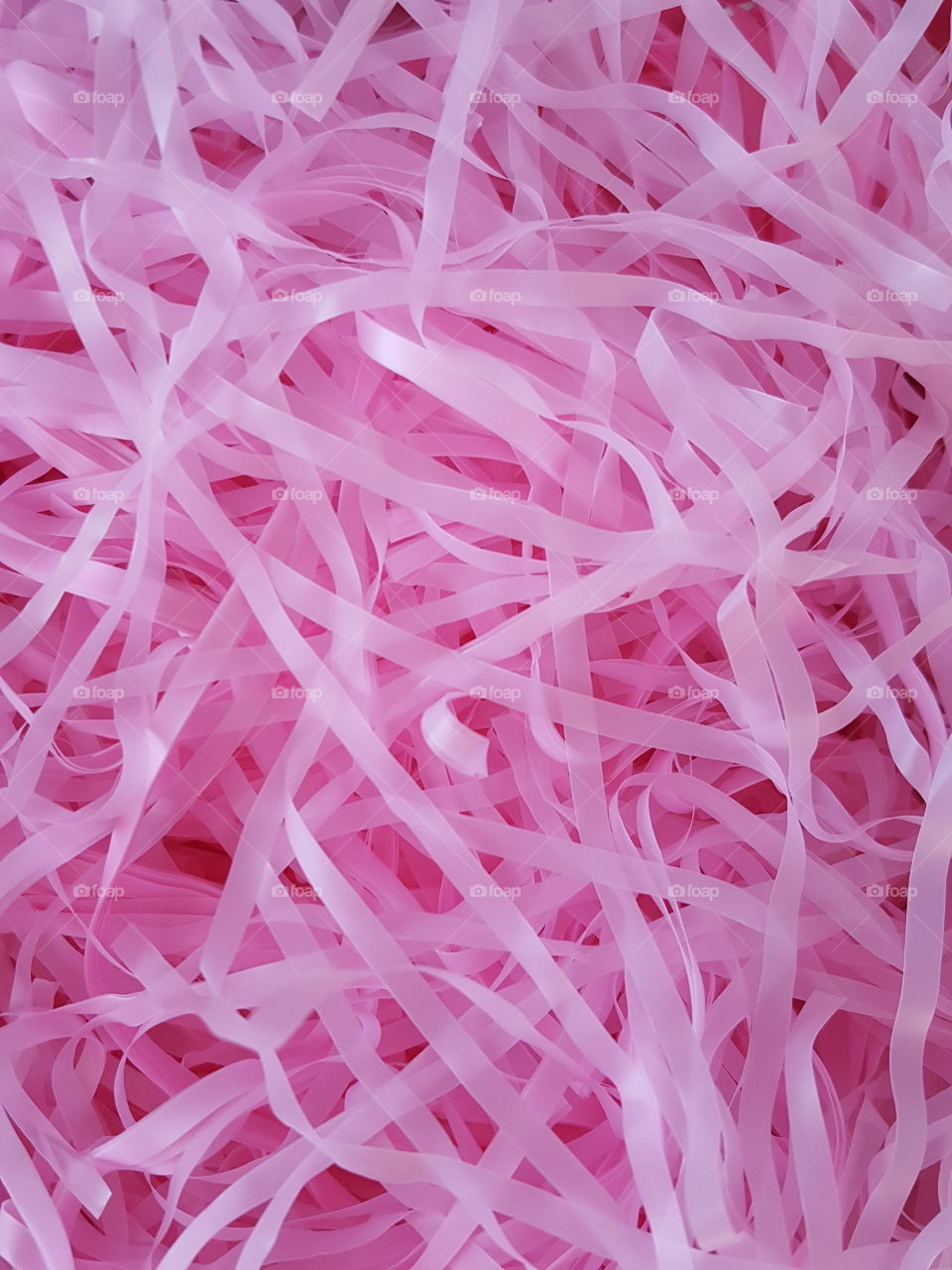 shredded pink paper