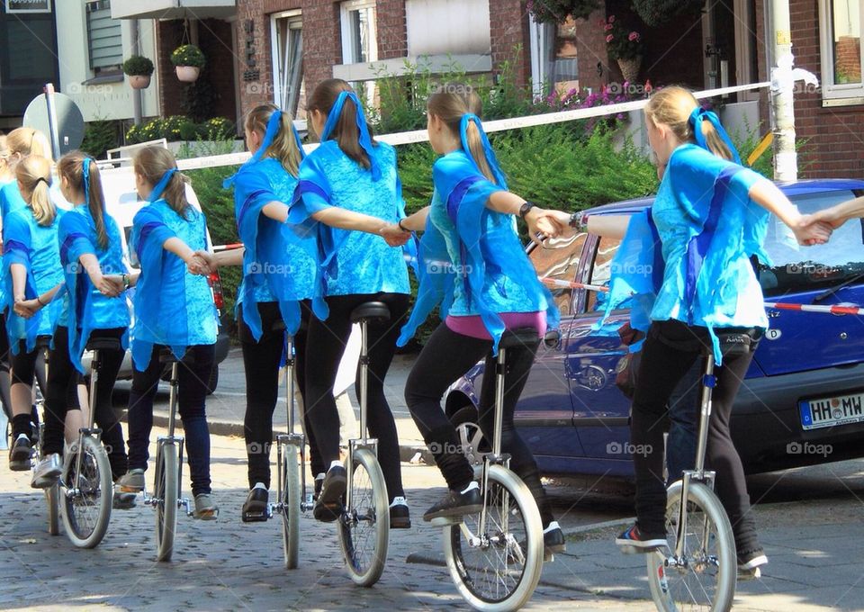 Girls on unicycle