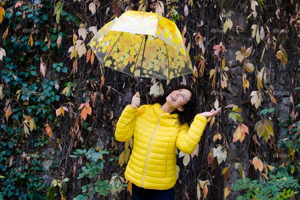 Smiling Young Girl on Autumn Background