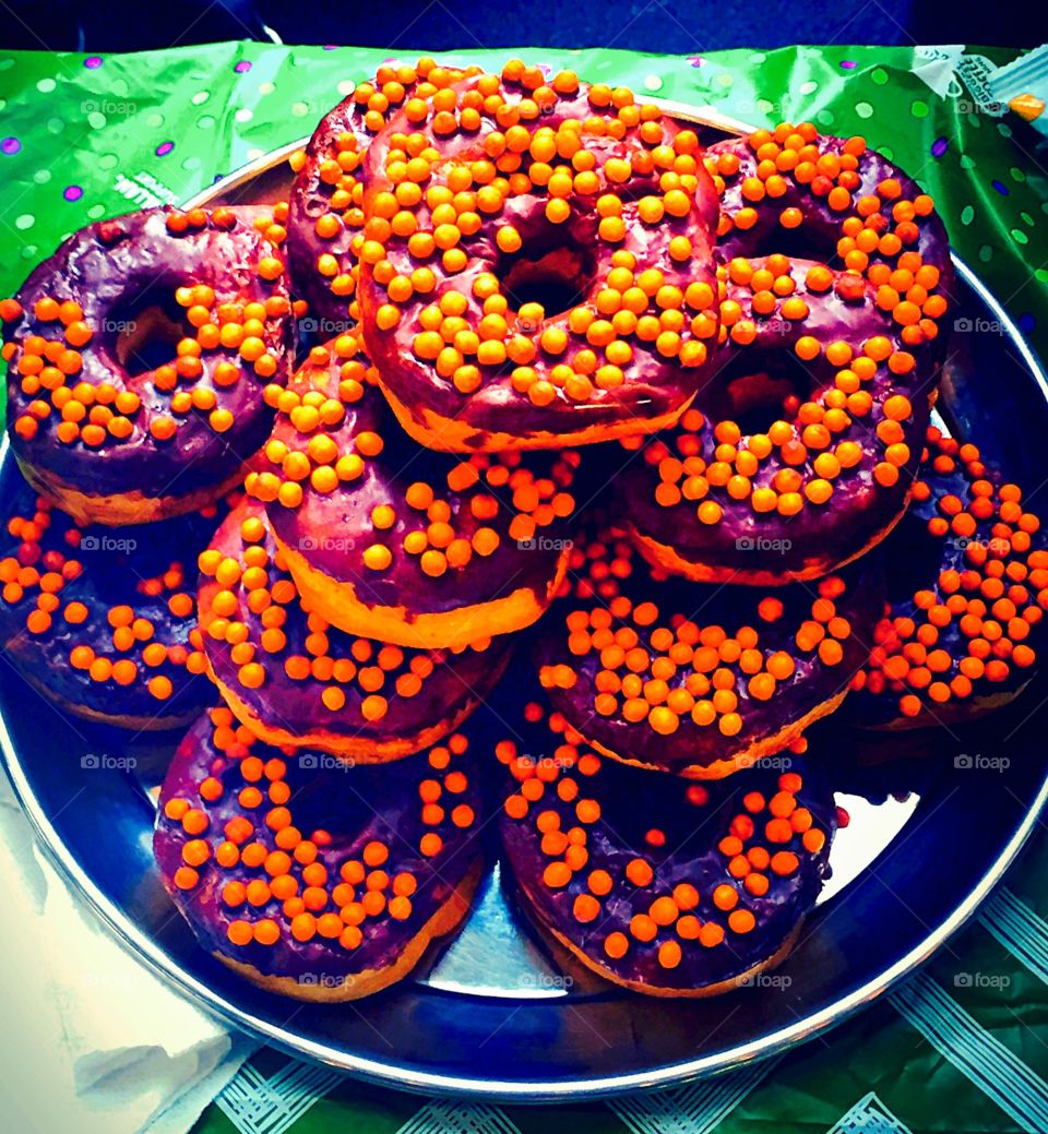 Plate of Donuts . Plate of tasty colourful donuts