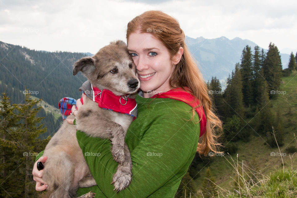 Woman and her dog in the alps