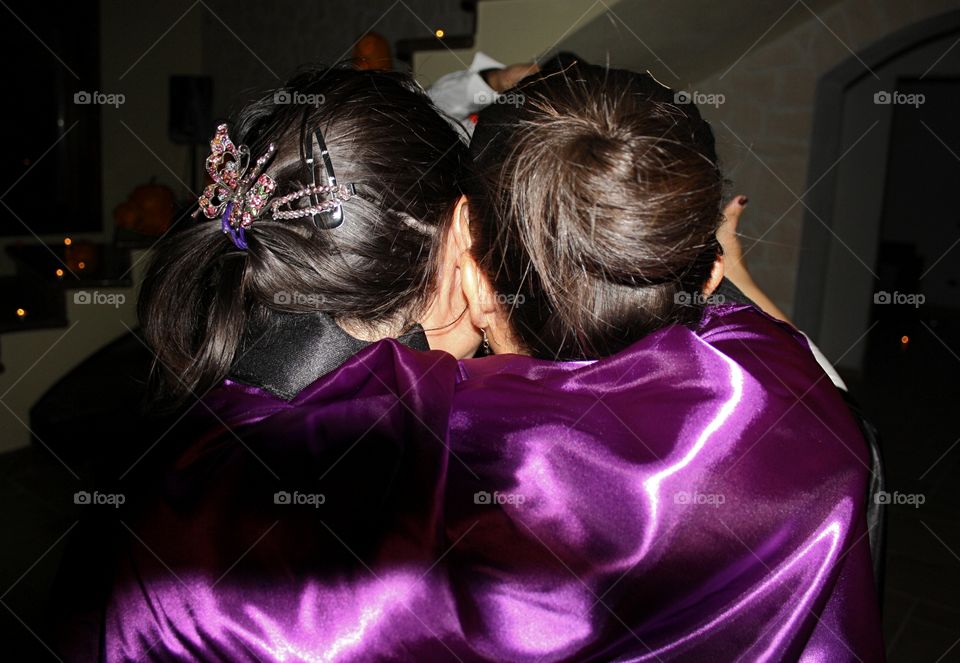 back view of shot of girls with purple cloak