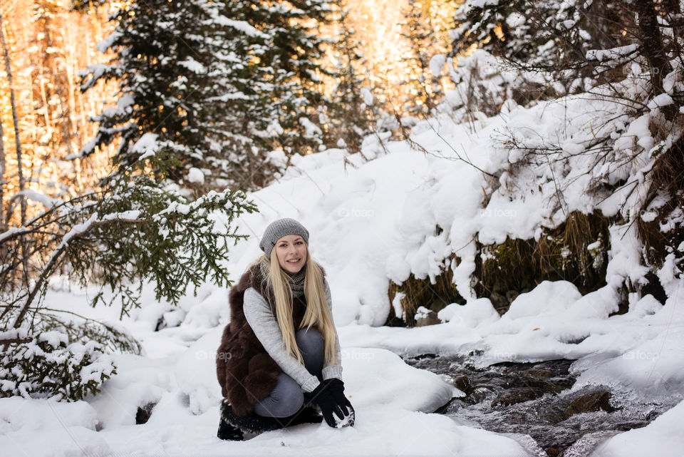 Woman playing in snow