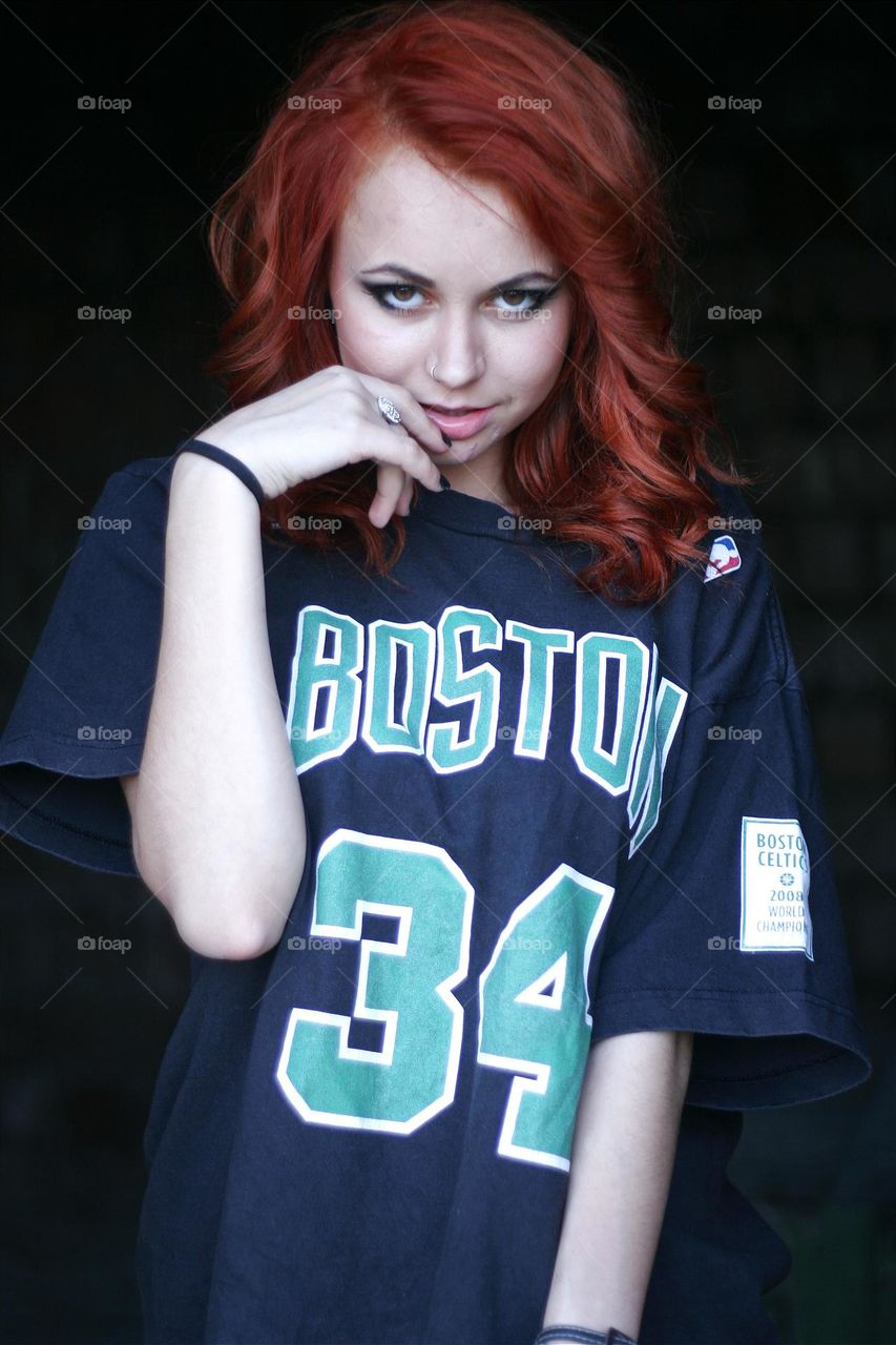 beautiful girl in a basketball T-shirt likes to pose