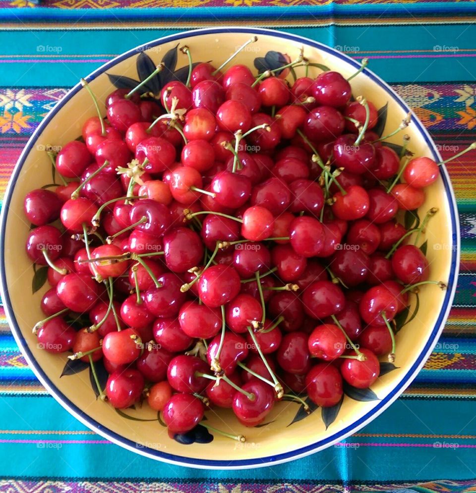 Bowl of juicy colourful red cherries