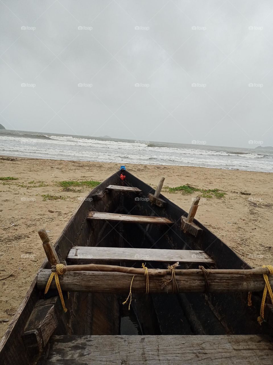 view of the sea from inside the black colour boat it's beautiful