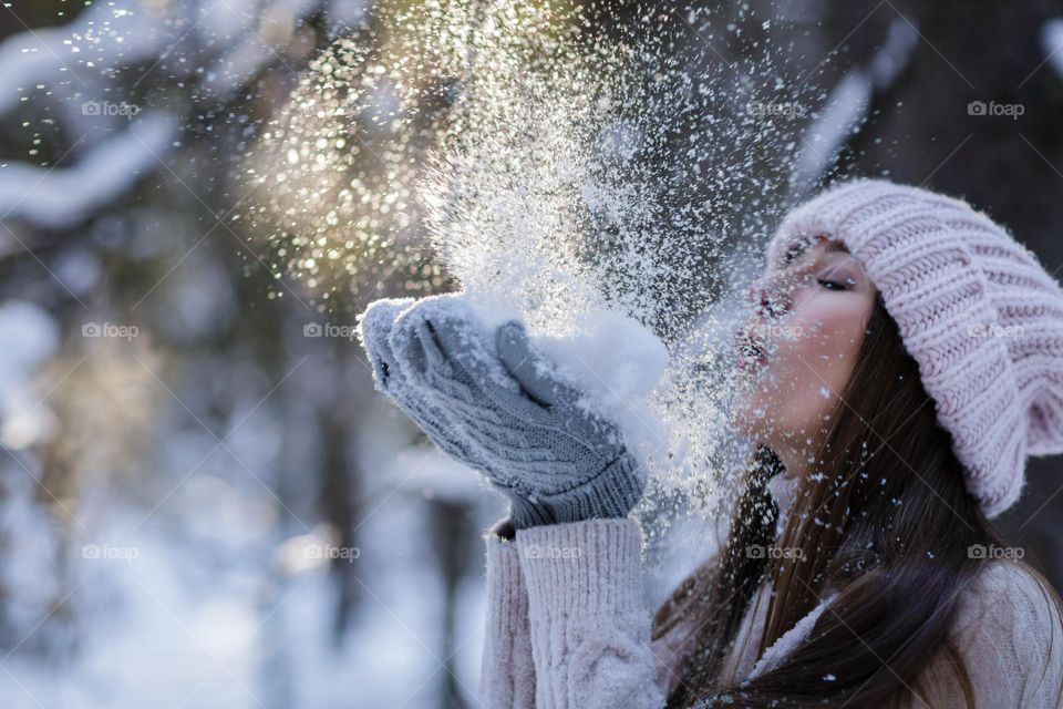 Beautiful woman having fun at winter 