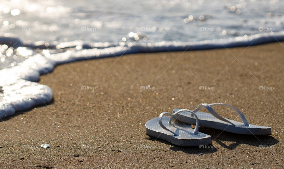 Sandals by the sea