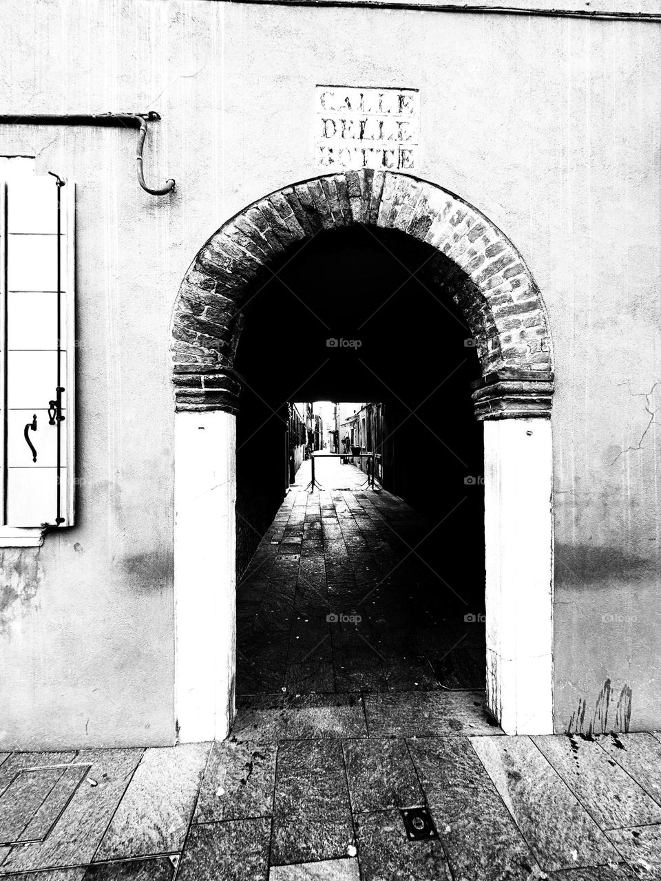 Arch in Burano, without colors. Black and white city photography 