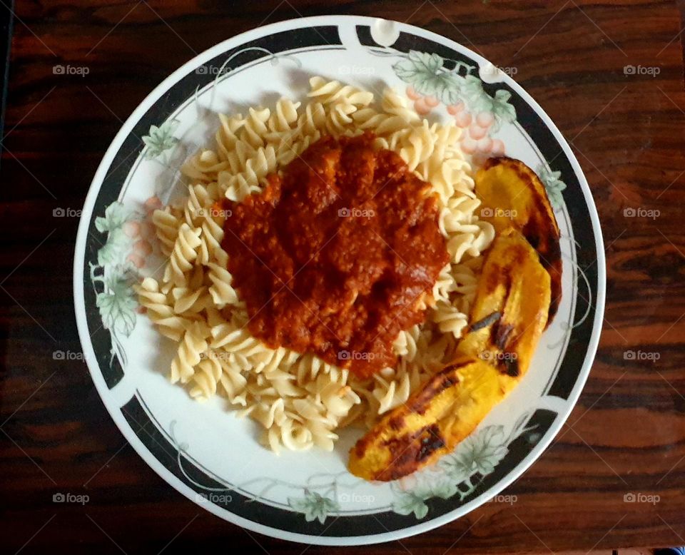 nothing like some delicious pasta screws with meat sauce and fried plantain slices!  safety pin