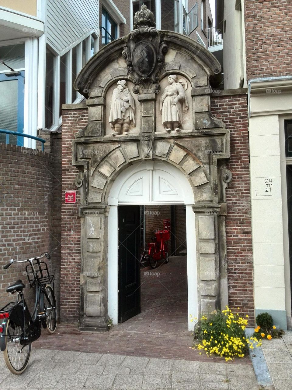 One lonely bicycle in front of a mysterious gate in Amsterdam