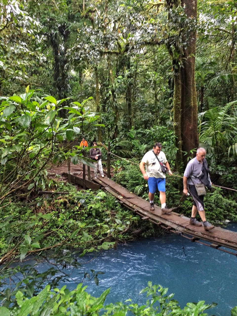 Crossing the blue river Costa Rica