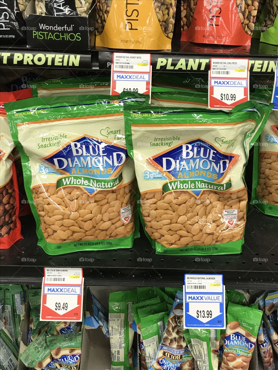 Packages of plain, natural almonds at the supermarket. These healthy nuts are a must in one’s household. They can be snacked on or eaten with other healthy food such as avocado and salad.