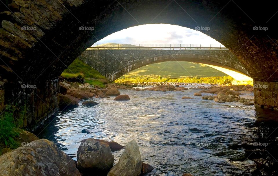 Rock bridges over the water at Carbost , Skye , Scotland