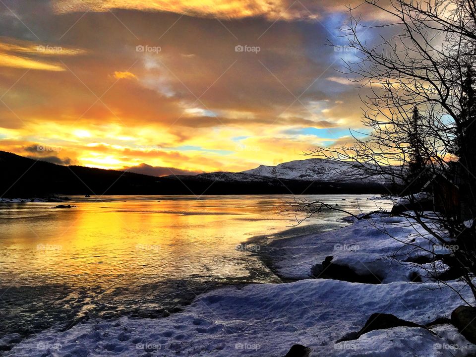 Sunset on winter lake 