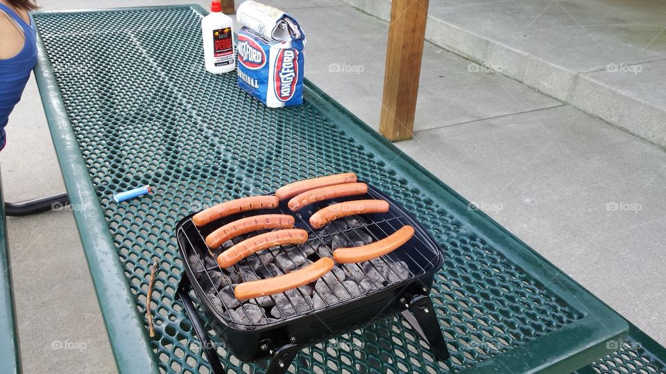 hot dogs on the grille