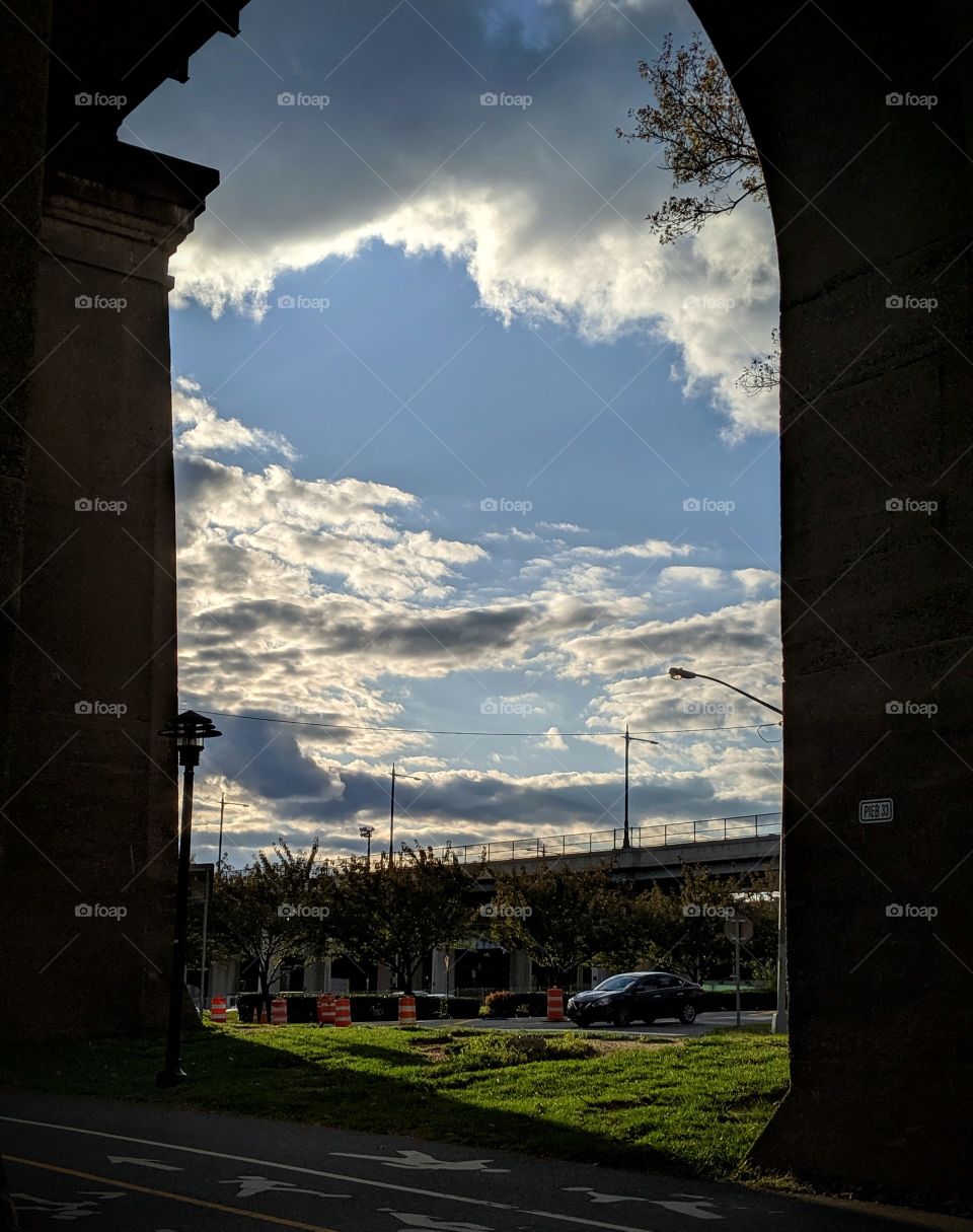 walk, architectural framing, cloudy skies, island